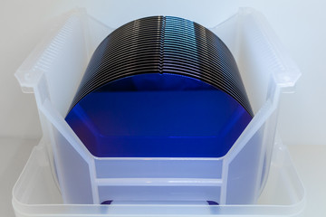 Close up of Silicon wafers blue color prepared for production in a semiconductors manufacturing...