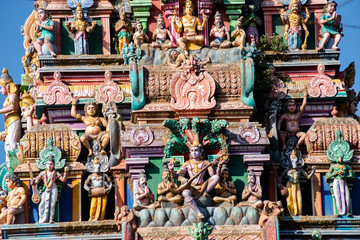 Hindu temple in Tamil Nadu, South India.  Sculptures on Hindu temple gopura (tower), sculpture of an Indian deity