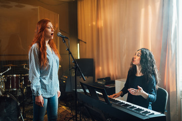 Female musician accompanying a vocalist