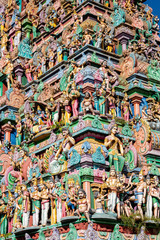 Hindu temple in Tamil Nadu, South India.  Sculptures on Hindu temple gopura (tower), sculpture of an Indian deity
