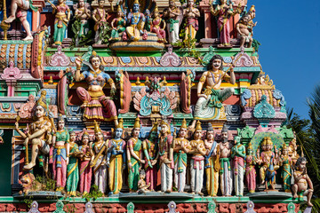 Hindu temple in Tamil Nadu, South India.  Sculptures on Hindu temple gopura (tower)
