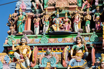 Fototapeta na wymiar Hindu temple in Tamil Nadu, South India. Sculptures on Hindu temple gopura (tower) 