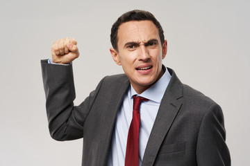 young businessman showing thumbs up