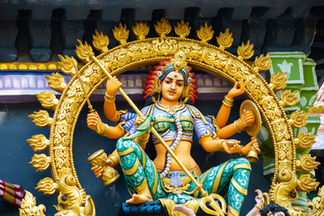 Hindu temple in Tamil Nadu, South India.  Sculptures on Hindu temple gopura (tower)
