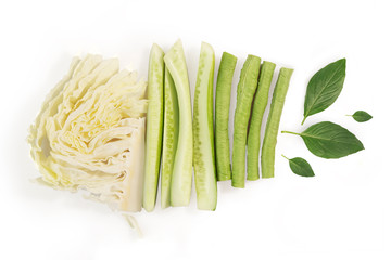 Vegetables, side dishes. Cabbage, cucumber, peas, basil. on white background. top view