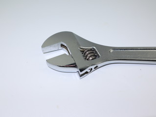 close up shot of adjustable wrench isolated on white background.