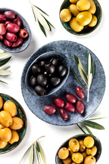 Olives, green, black and red, shot from above on white