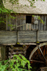 Water wheel and old mill in the woods.  Cades Cove, Smoky Mountains National Park, Tennessee