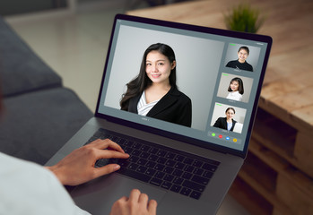 Fototapeta na wymiar Businesswoman making video call meeting to team online.