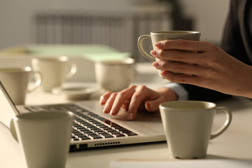 Overworked executive hands working late hours at night