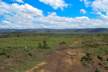 Scenic volcanic crater against a mountain background in rural Kenya, Mount Suswa, Rift Valley