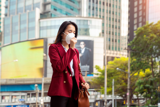 Asian girl use a protection mask for prevent PM 2.5 and corona viruus or covic 19