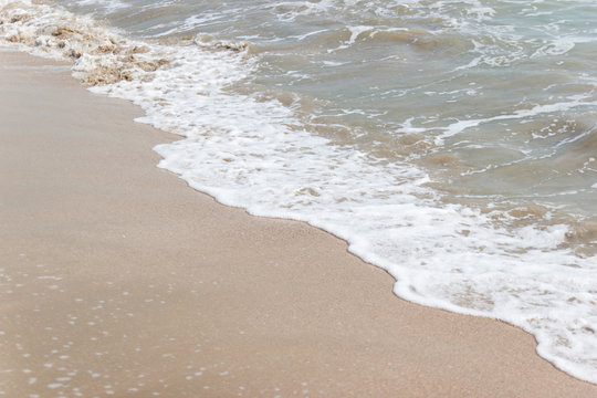 soft ware on sand at the beach, copy space for text