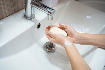 washing of female hands  soap and water