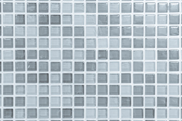 White or gray ceramic wall and floor tiles abstract background. Design geometric mosaic texture decoration of the bedroom. Simple seamless pattern for backdrop hospital wall, canteen and grid paper.