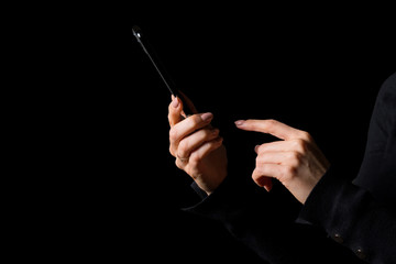 Person using mobile phone, photo isolated on black background