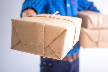 The delivery staff file a parcel box for customers who order products online. Online delivery...