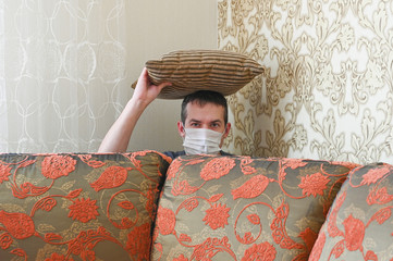 Young Caucasian man is messing around at home. Quarantine concept.