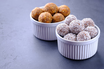Homemade raw chocolate  and lemon energy balls on dark background with copy space. Selective focus