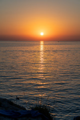 The sun is setting over the ocean