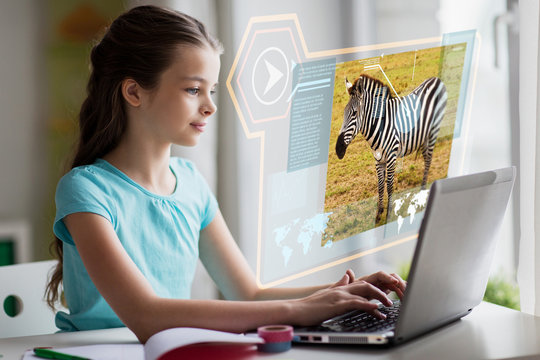 education, school and technology concept - girl with laptop computer and hologram projection learning nature online at home
