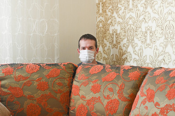 Young Caucasian man is messing around at home. Quarantine concept.