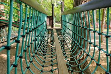 Children's playground made of wood in the park