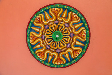Ceiling of Meenakshi Sundareswarar Temple in the South India, beautiful vintage ceiling paintings with pattern and lamp in the center in an Indian temple