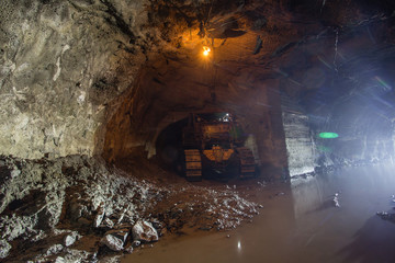 Underground gold mine shaft tunnel drift with bulldozer