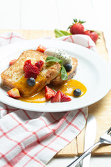 Toast with cream, strawberry and milk souse. Sweet breackfast