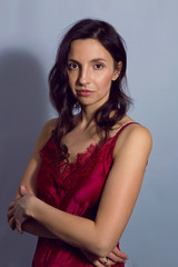 portrait of a brunette girl on a blue background