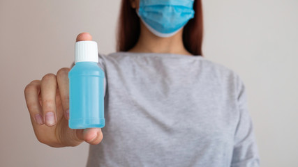 Alcohol gel in the hands of a woman.