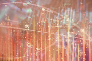 Double exposure of forex chart drawings over cityscape background. Concept of success.