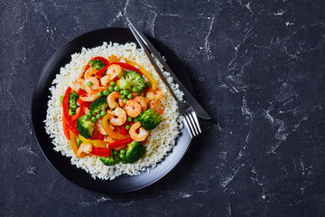 close-up of fried shrimps with veggies and rice