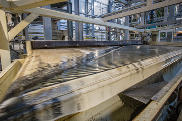 Chrome black sand heavy mineral concentrate on shaking washing table mining factory