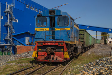 Naklejka premium Freight train on railway railroad mining site