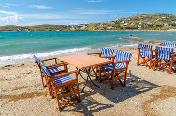Fototapeta na wymiar Romantic tavern on the sea coast in Paros island, Cyclades, Greece. Europe.