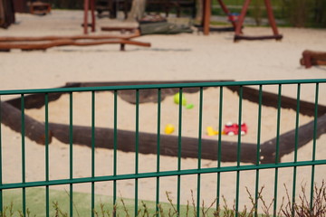 Fototapeta premium Children's playground is closed. Ban on children 's playgrounds. Prevention of coronavirus COVID-19. The fight against the virus. No children on the Playground in the yard.