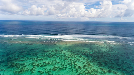 Tropical beach and sea with blue sky background. Aerial view.
