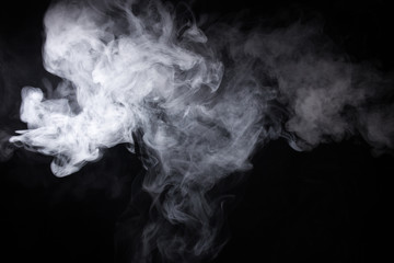 Cloud of white smoke on a black background closeup