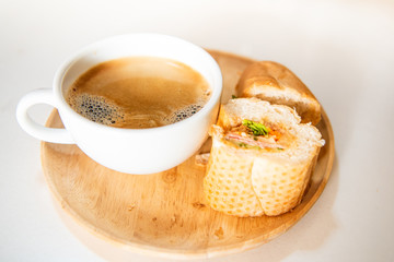 Hot fragrant coffee with bread for breakfast