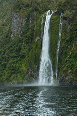 Fototapeta na wymiar Waterfall in Milford Sound in Fiordland National Park in Southland on South Island of New Zealand 