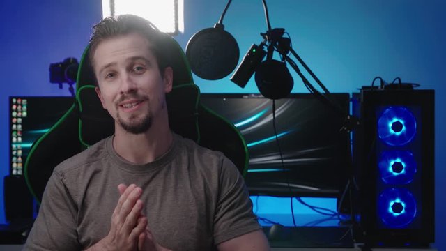 Gamer interview with a colorful computer workspace in background 4K
