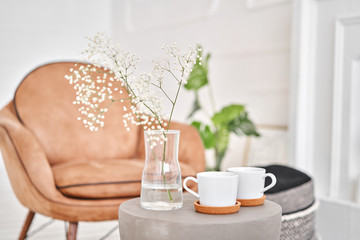 White cups on a concrete table. two cups of hot coffee. Concept of renting an apartment or bed and Breakfast