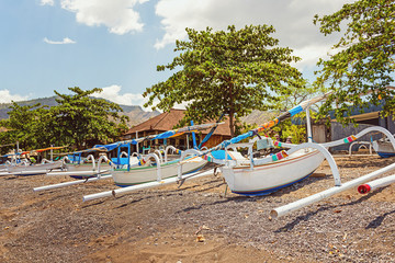 Fototapeta na wymiar Balinese old fishing wooden boats in Amed, Bali, Indonesia