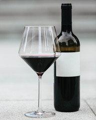 Wine Bottle and Glass on the pavement