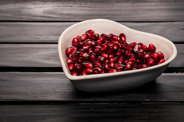 grains garnet in dish on black