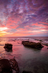 Obraz premium Cloudy sunset sky over the sea during twilight time