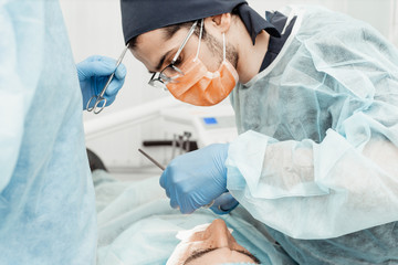 Dentists will perform an operation, implant placement. Real operation. Tooth extraction, implants....
