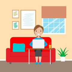 Woman sitting on the sofa working with laptop. Telecommuting